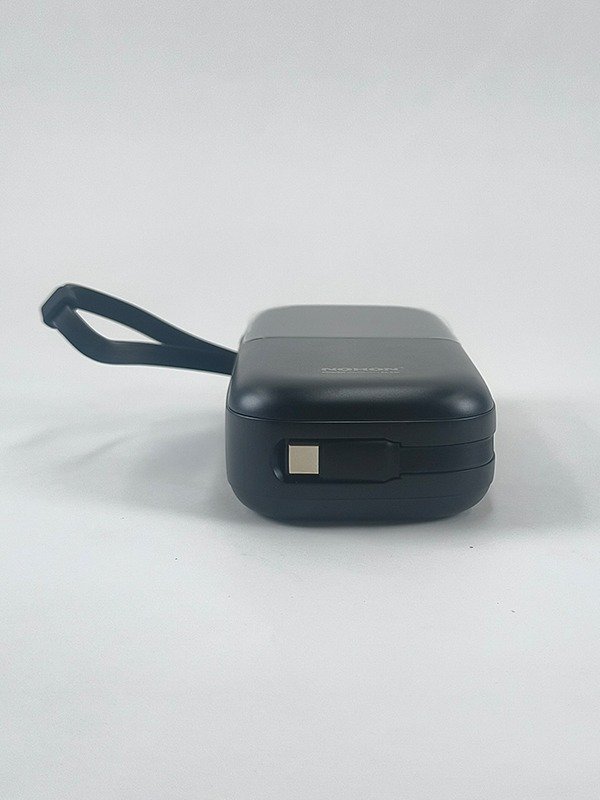 NOHON NX-P02 white power bank with built-in charging cables and digital display.