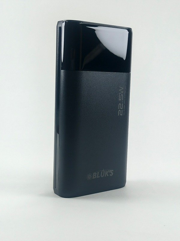 Black BX-305 20000mAh power bank showing digital LED display and multiple charging ports.